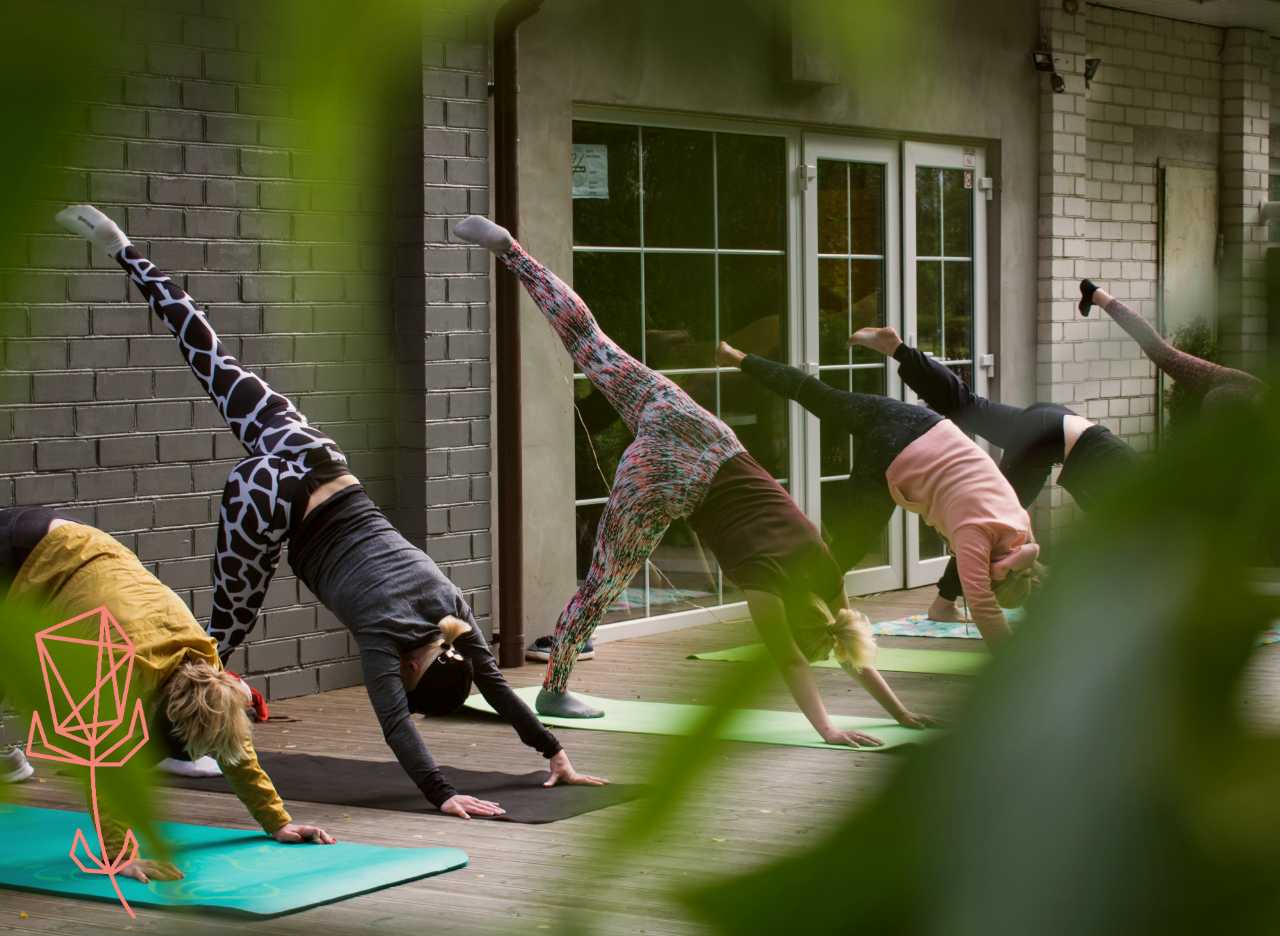 Women doing an exercise class outdoors on a patio